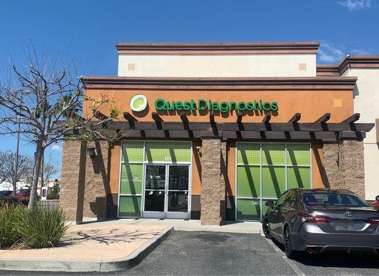 Another view of the building located in a strip mall next to a nail salon.