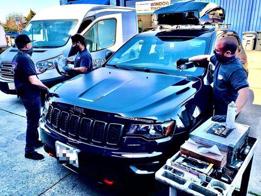 Austin and Shelby putting in some tender loving care into the new Jeep Grand Cherokee Trailhawk.