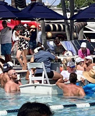 Beer keg in pool on rowboat