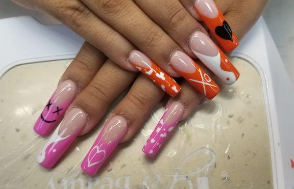 Long nails with hand design art.