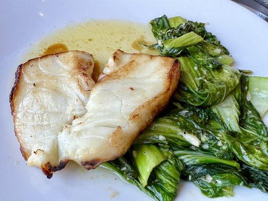 Sea Bass with nice sear but entirely sauced in clarified butter and needing a starch