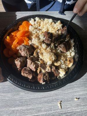 Disgusting beef hibachi served on a plastic plate.