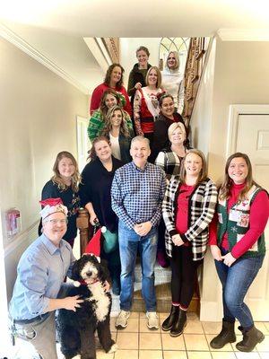 The whole staff (including therapy dog Laszlo) at our annual holiday gathering.