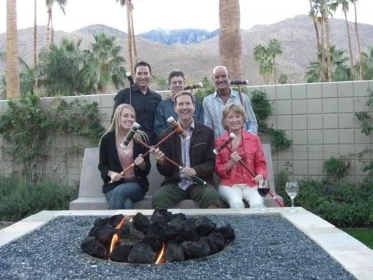 Around the BILTMORE fire pit with friends for a game of croquet