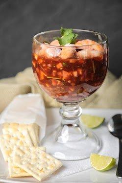 Shrimp and pico de gallo mixed with a tomato vinegar puree, served with crackers.