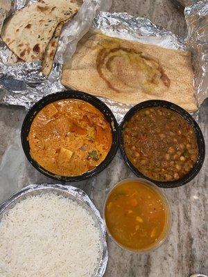 From left to right, Garlic Naan, Masala Dosa, Chana Masala, Paneer Tikka Masala.