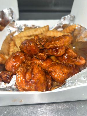 Katie O's Chicken Bite Box, Tossed in our homemade Sweet BBQ sauce on a bed of seasoned fries!