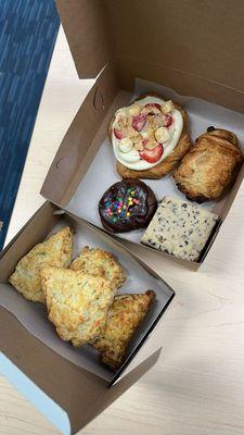 Bacon cheddar scallion scones, cosmic brownie cookie, chocolate chip cookie dough brownie, chocolate croissant, strawberry cheesecake snail.