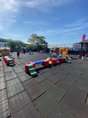 Our outdoor rooftop playground provides plenty of room for fresh air and gross motor development