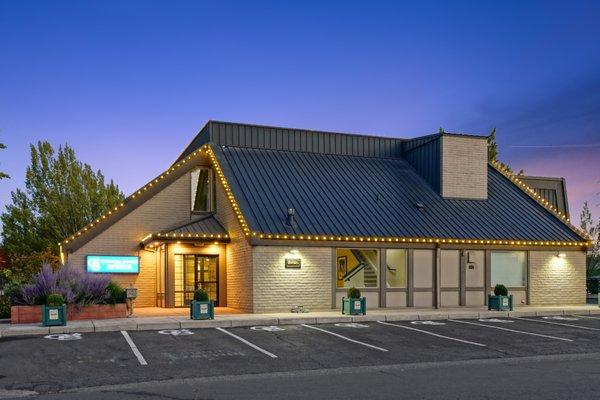 Exterior front entrance with lighted sign.