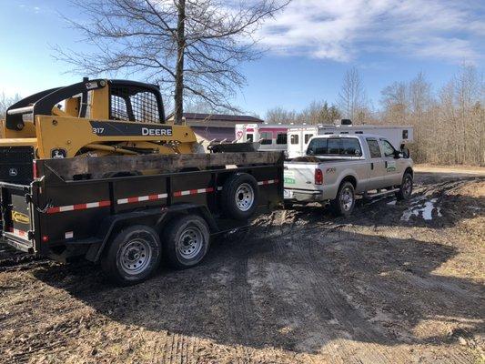 Skid steer and dump trailer service