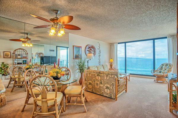 Unit 717 at The Mahana dining room looking into living room and view of the ocean.