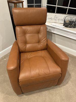 Glider and swivel leather chair.