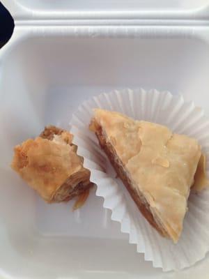 Half eaten rolled baklava & traditional baklava