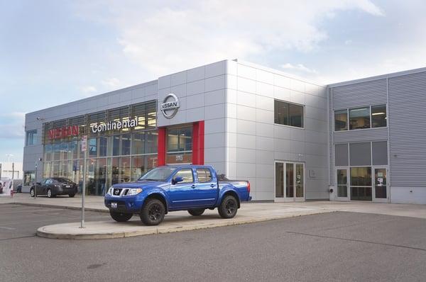 Nissan storefront featuring a Nissan Frontier truck.