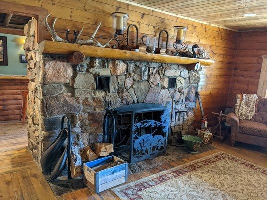 The fireplace just steps from the main check-in, lobby entrance.