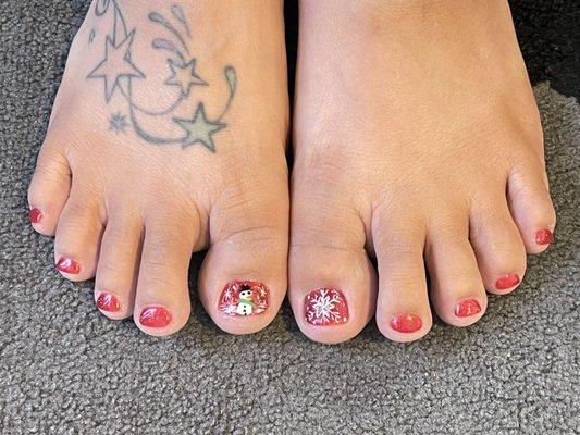 Gel pedicure with hand drawn holiday art