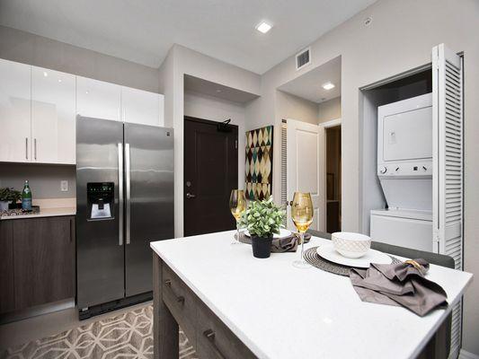 Designer kitchens with stainless steel appliances.