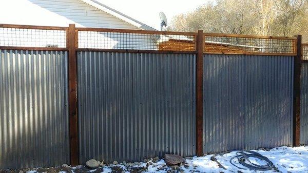 Cutsom corrugated metal fence with mesh on top