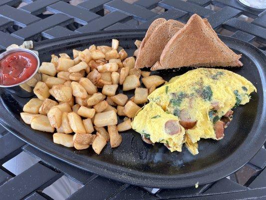 Build your own Omelette with sausage, spinach, mushrooms and cheddar cheese.