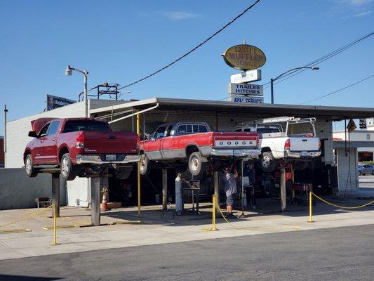 Exterior shot with three trucks in for exhaust work.