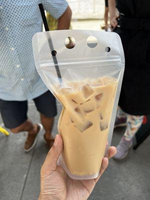 Iced horchata oat milk latte, served in compostable bag