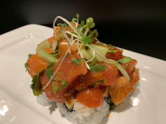 Our Rancho roll is a California roll base with salmon and tuna sashimi mixed with cilantro tomato smelt egg and avocado