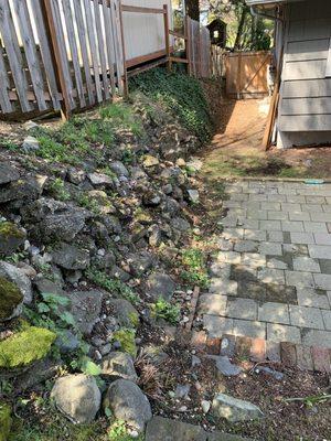 Before- crumbling rock wall