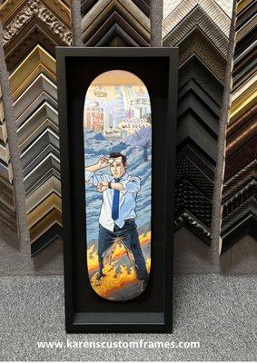 Custom framed skateboard deck in a shadowbox frame with museum glass.