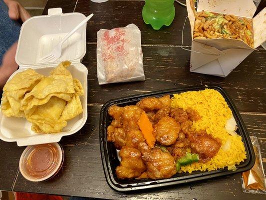 Honey chicken combo, crab Rangoon, shrimp lo mein and egg rolls with sweet and sour sauce