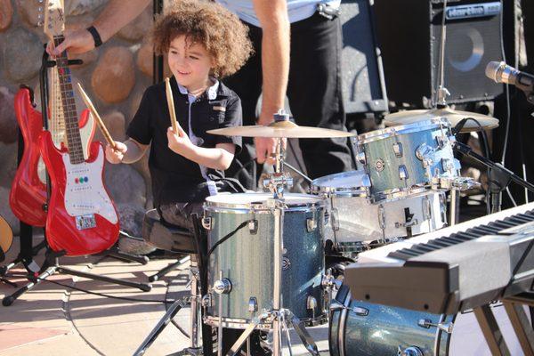 KidzRock student performing at Santee Trolley Square.