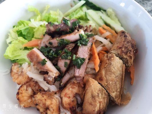 Combination noodle bowl - grilled pork & shrimp - served with shredded lettuce, bean sprouts, cucumbers, pickled carrots, daikon radish.