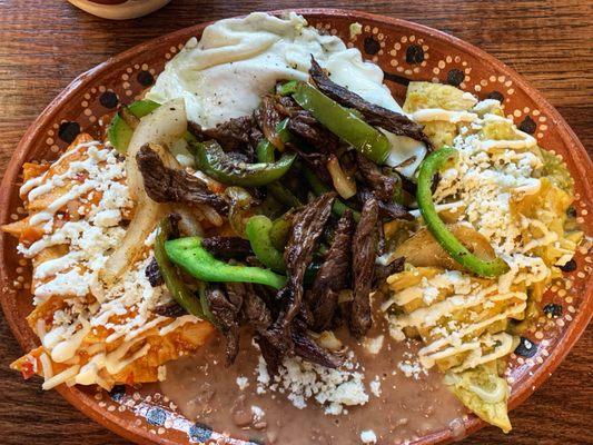 Duo chilaquiles with beef fajita meat.