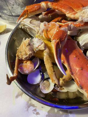 Captains boil with King Crab and Clam add ons steamed with a side of butter and lemon