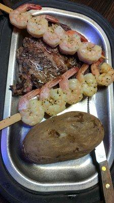 Ribeye special - 8 oz Ribeye, potato, 2 shrimp skewers, soup & salad bar for $15!