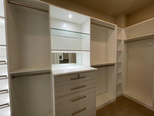 Drawer chest in Tuscan Moon material.  Glass insert shelf. Puck lighting.