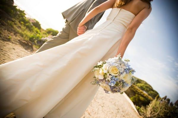 My bouquet- blue hydrangeas, white roses, delphinium, stephanotis, etc wrapped in white silk ribbon.