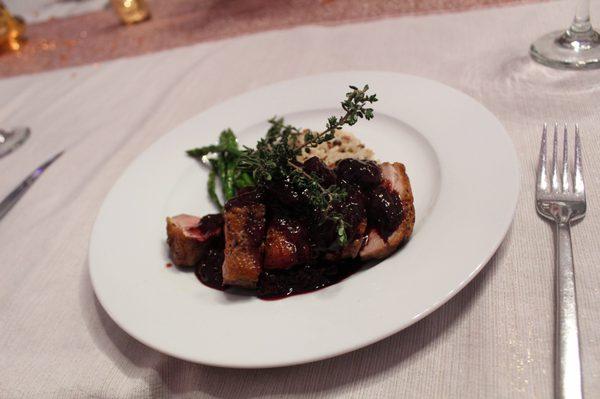 Duck with a merlot cherry sauce; asparagus and wild rice