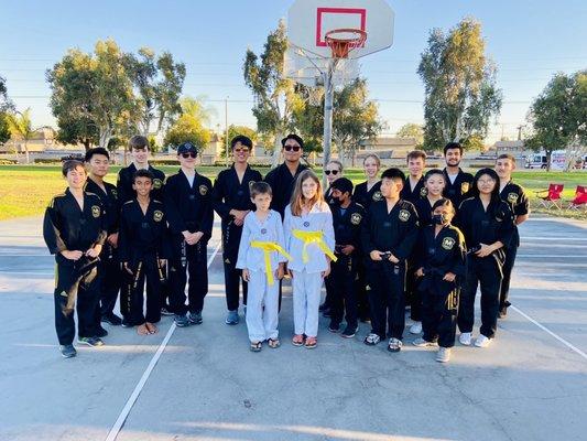 8/30/2022 Belt Ceremony - Master Kim, masters black belts, and Zoe & Evan