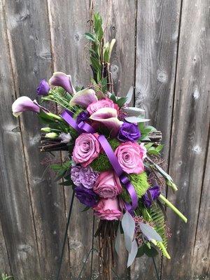 Sympathy cross with purple lisianthus and Picasso calla lilies