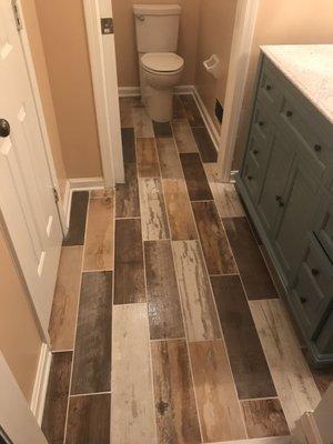 We installed the tile floor and vanity