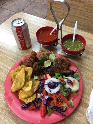 #8 1/4 roasted chicken, chicharrones, tostones and salas. Of course the red and green sauces.