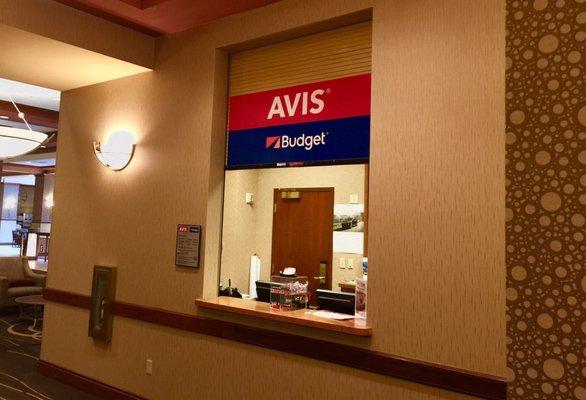 The Avis counter inside Embassy Suites.