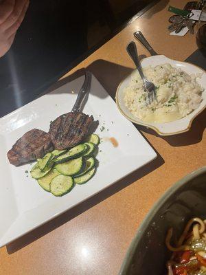 Two Petite Filets with zucchini and risotto.