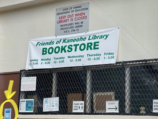 50% off sign outside door. Inside, says AUGUST 50% cookbooks and educational. The bookstore lady said that sale was for "July" .