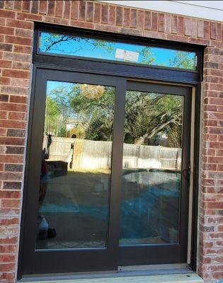 After: sliding door to the pool, and window above that Hector ordered and installed