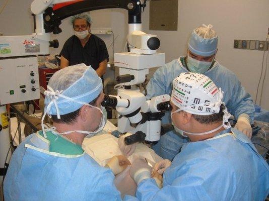 Dr. Howitt and Dr. Paris in the operating room.