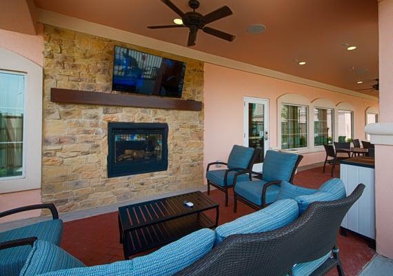 During you stay in El Paso, Texas, relax and unwind by the fireplace on our hotel's outdoor patio.