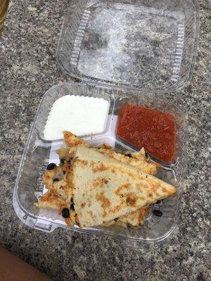 Chicken and black bean quesadilla with mild salsa and sour cream