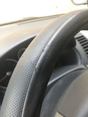 Torn up steering wheel cover